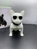 Mini Bluetooth speaker shaped like a bulldog, shown in black, red, and white colour options.