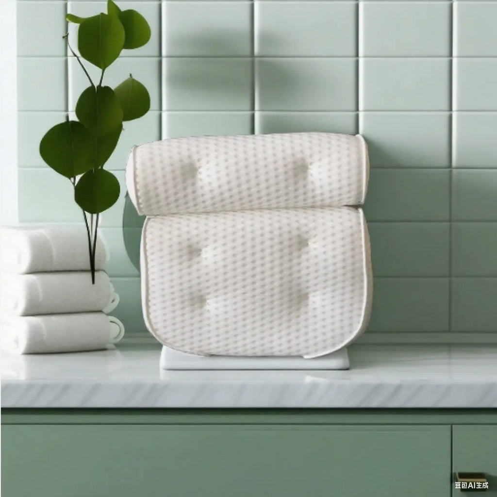 White bathtub pillow with suction cups and mesh construction measuring 37cm by 34cm