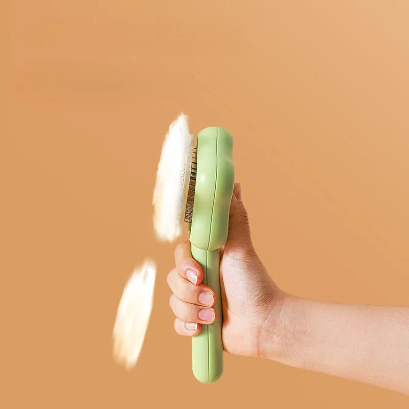 Green self-cleaning cat comb magic wand with stainless steel needles for pet grooming