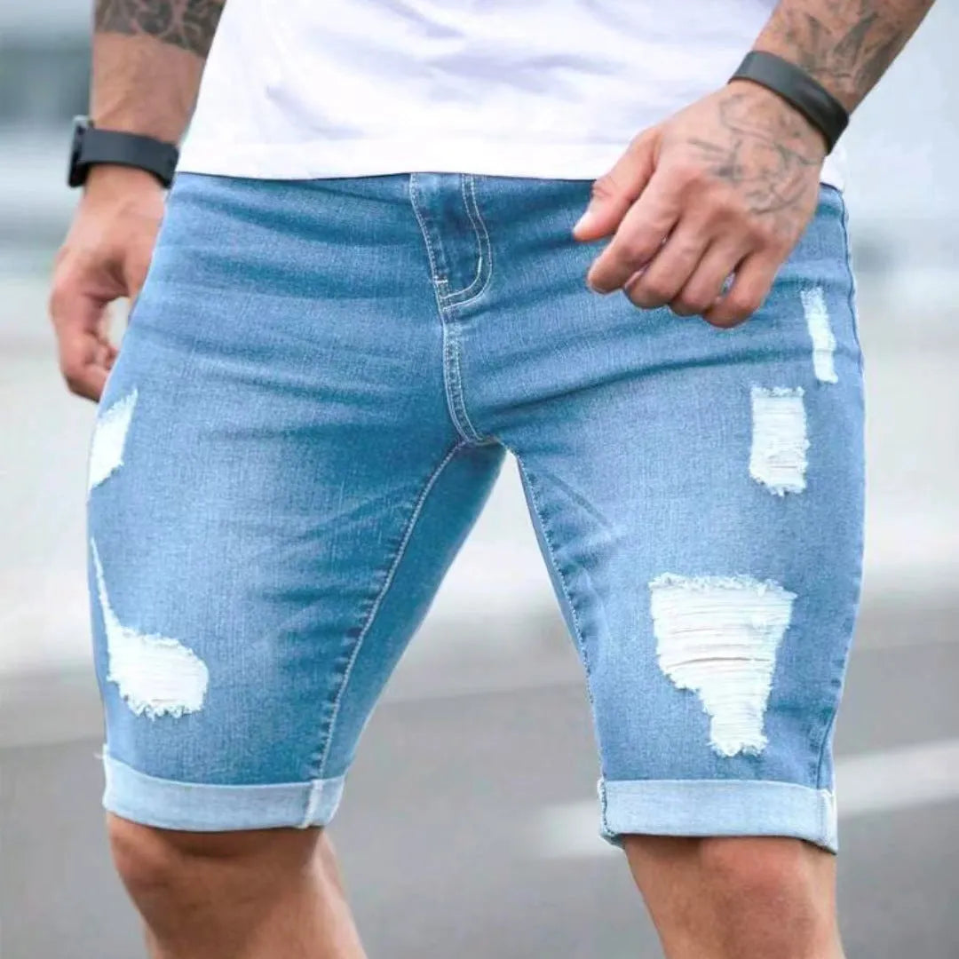 Sky blue distressed denim shorts with low-rise waist and zip fly closure