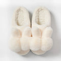 Women's rabbit fur slippers in grey with flower details and a high upper.