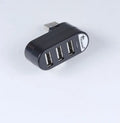 Black and white USB 2.0 hub splitter, a multi-port expansion hub for computers and laptops.
