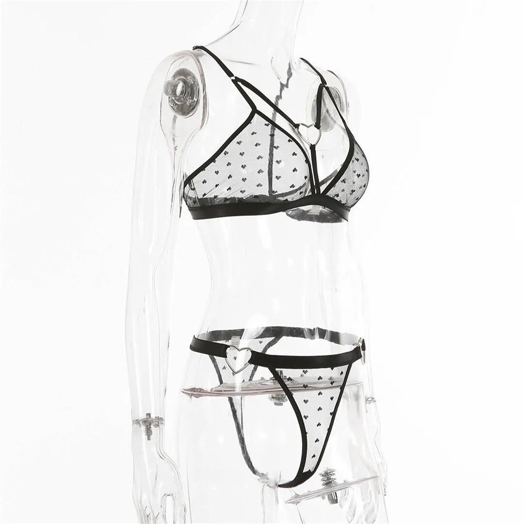 Ladies' black mesh two-piece set comprising a top and matching trousers made from stretch spandex fabric.