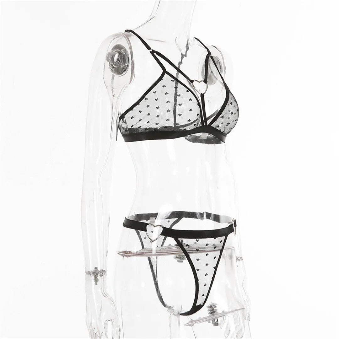 Ladies' black mesh two-piece set comprising a top and matching trousers made from stretch spandex fabric.