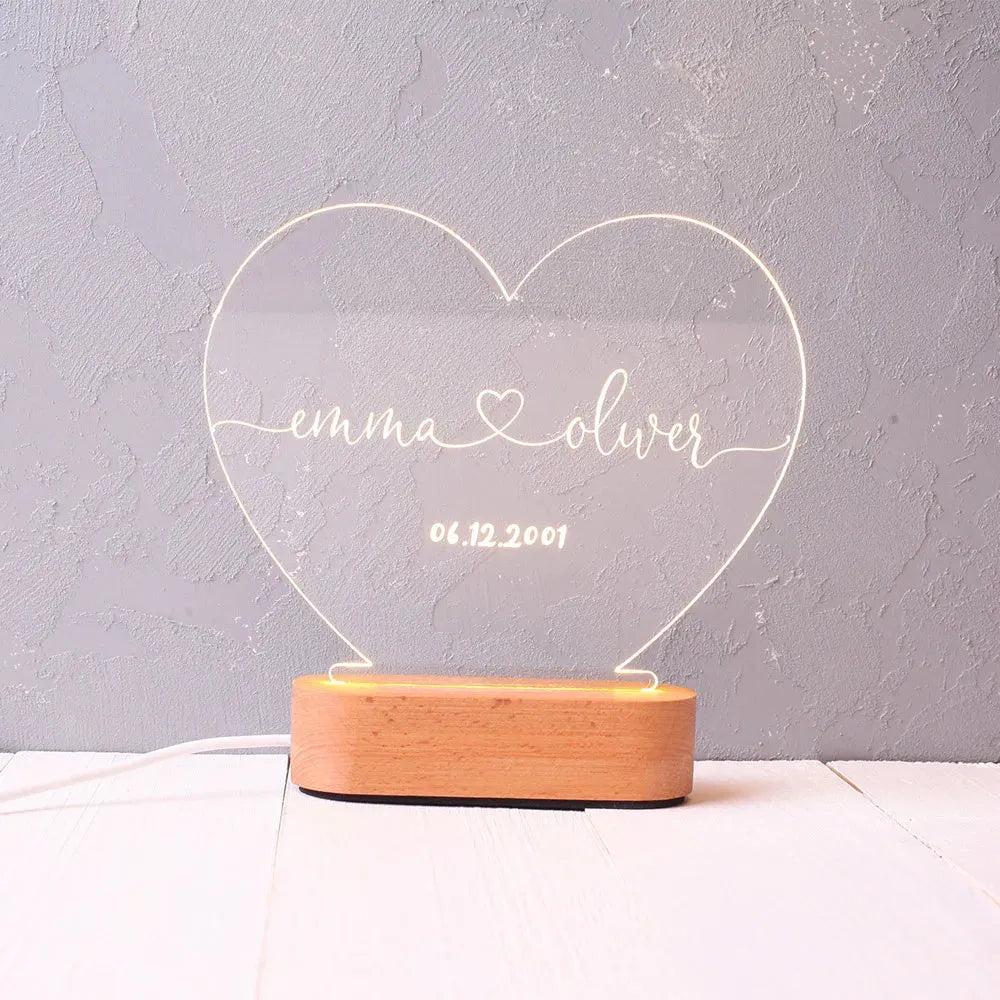 Personalised acrylic LED night light showing custom names and date, modern art design, 20cm by 11.5cm
