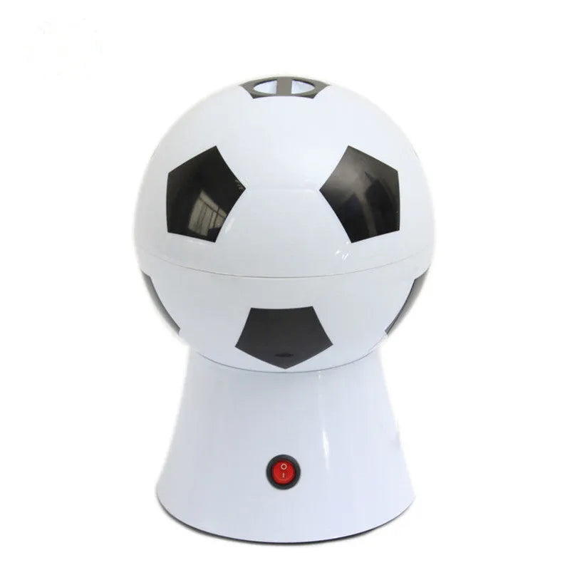 Black football-shaped electric popcorn machine with round insert and popcorn collector bowl