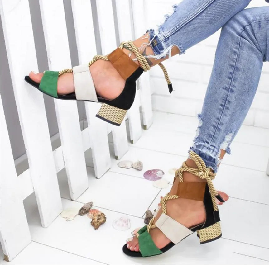 Women's beige suede sandals with fish mouth toe, thick heel, and front ankle strap.