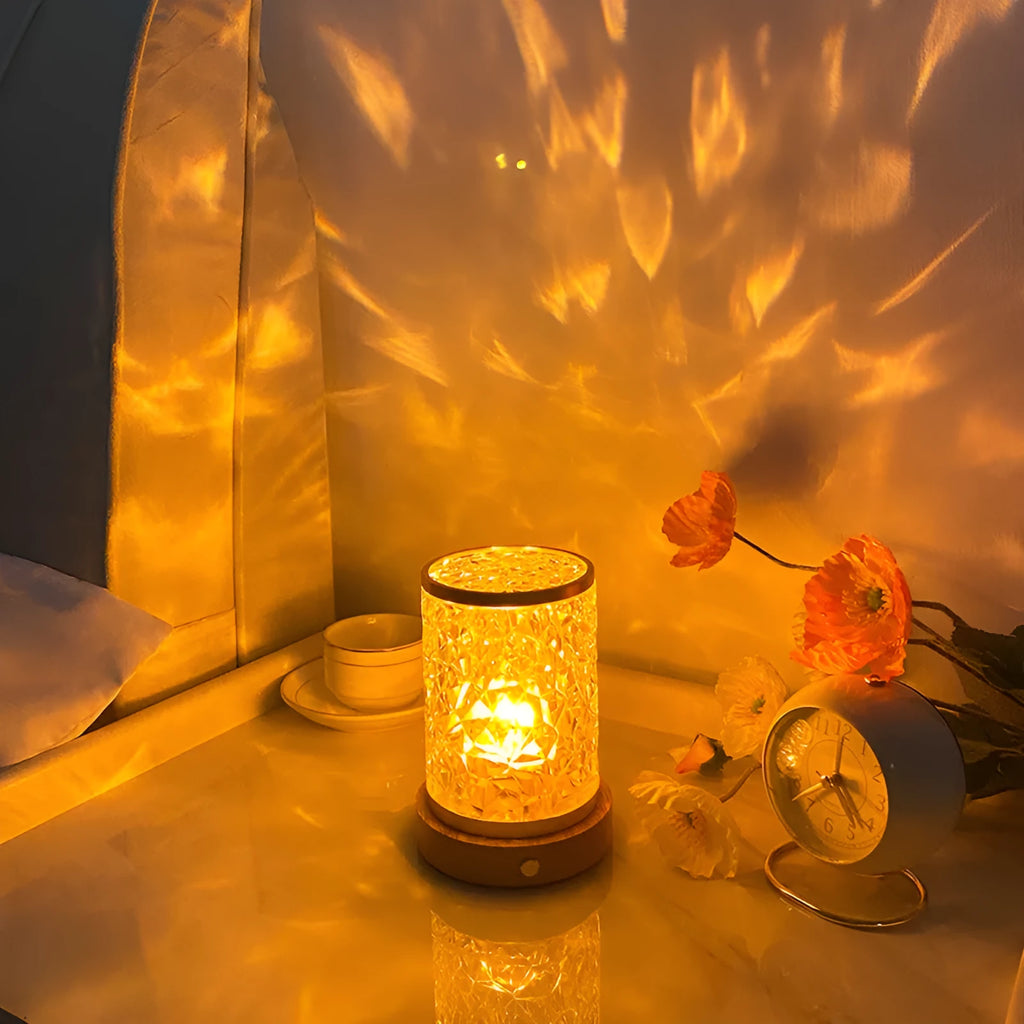 Compact acrylic rotating water ripple night light on a solid wood base with USB cable.