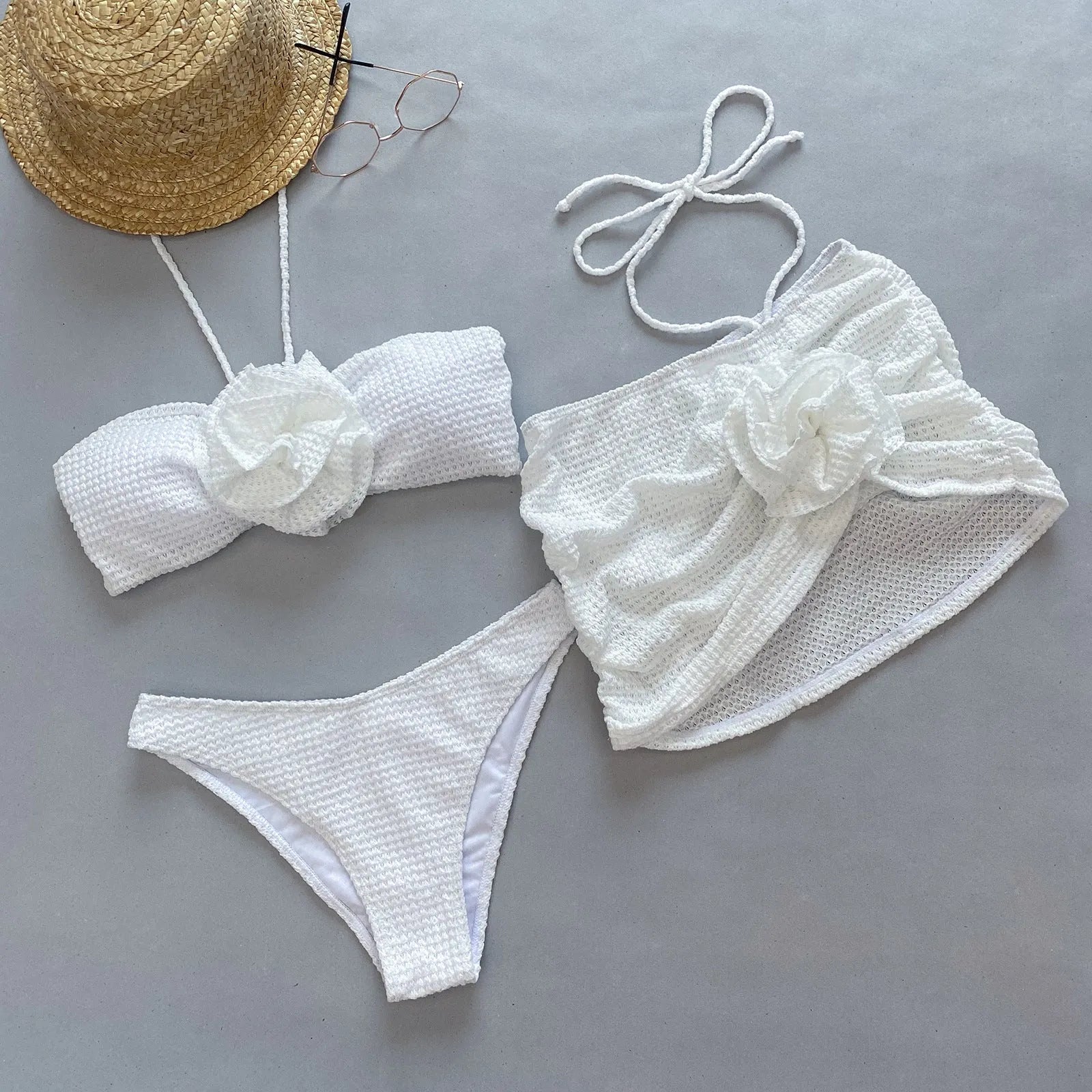 Women's three-piece bikini set with 3D flower split design in purple and white colour options