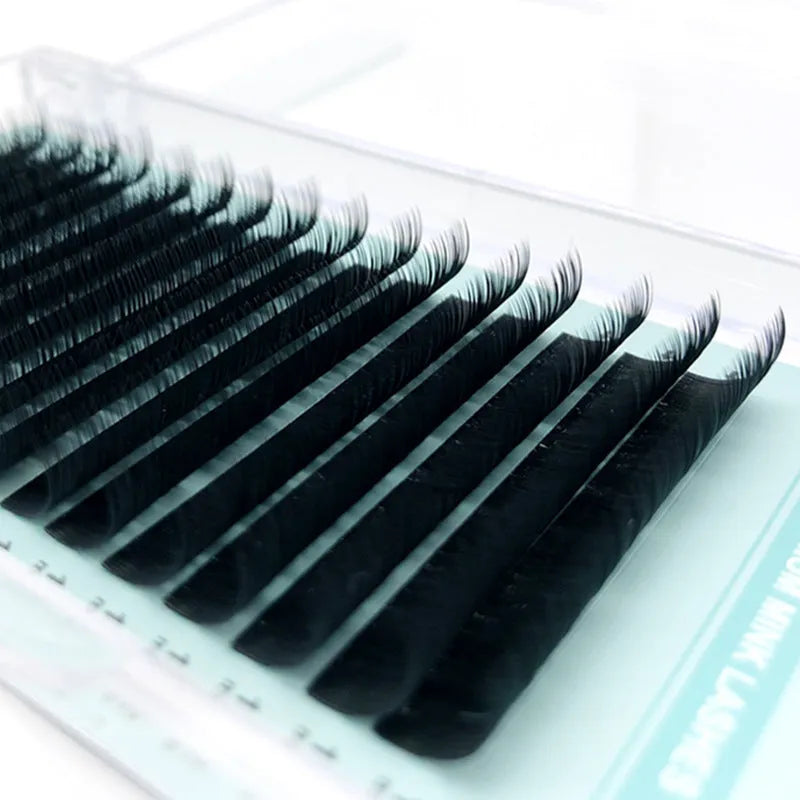 A pair of women's false eyelashes with soft velvet texture, showing length options from 7mm to 15mm.