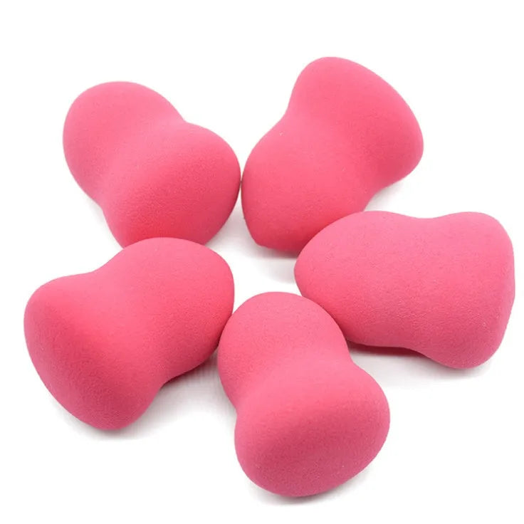 Pink makeup foundation sponge with soft texture measuring 4cm by 4cm by 5.6cm