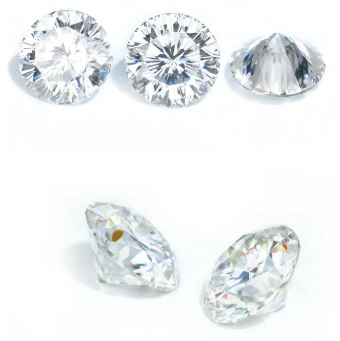 Round loose moissanite stone with eight hearts and eight arrows brilliant cut on a jewellery tray.