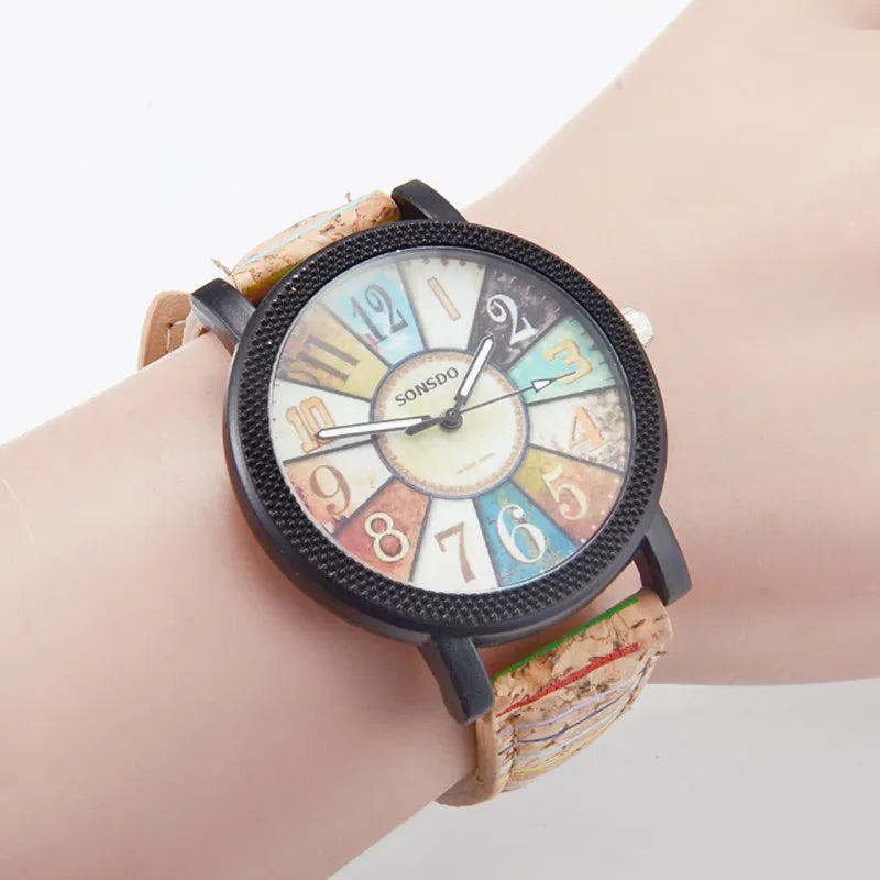 Women's vintage-style quartz watch with brown leather strap and round silver dial