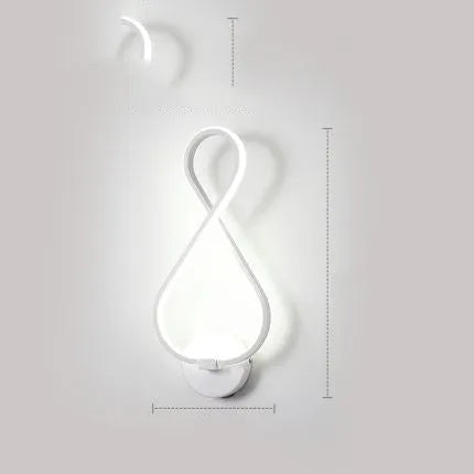 Nordic minimalist LED wall lamp with silicone shade in black finish mounted beside bed