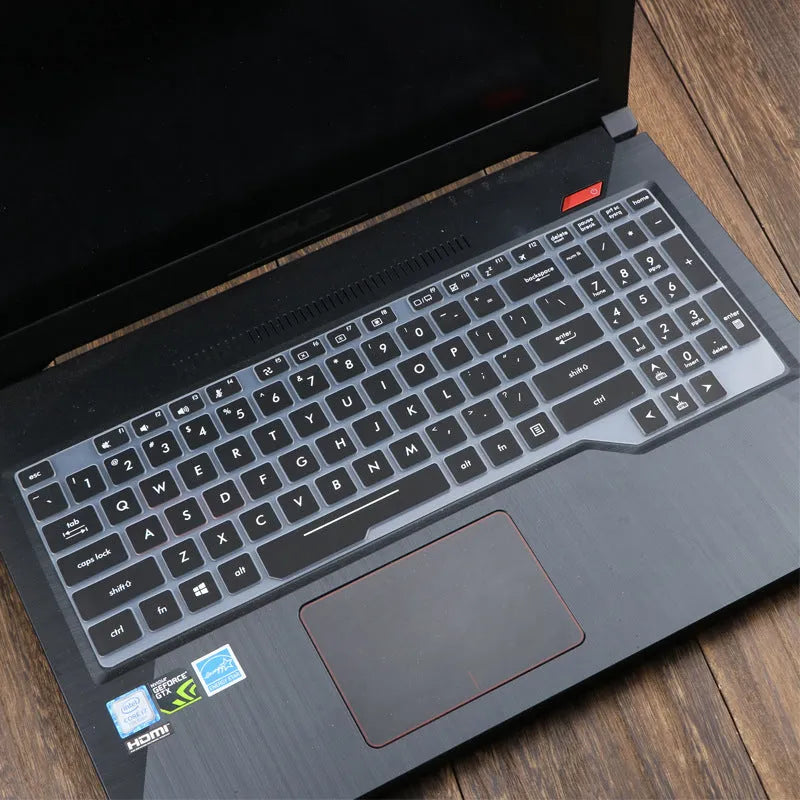 ASUS VivoBook 15 X513 laptop with a translucent mint coloured silicone keyboard protector fitted.
