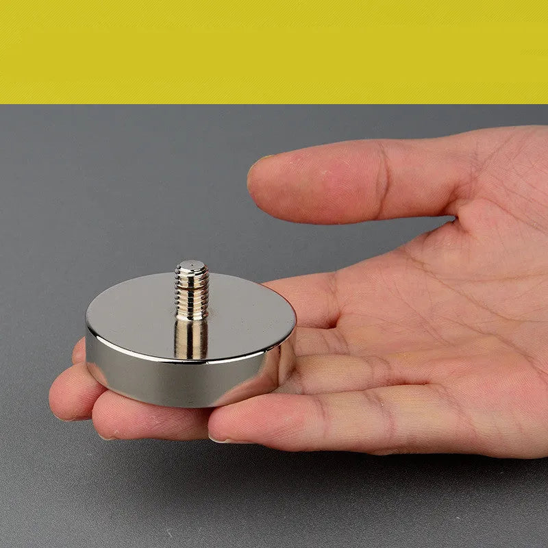 Round 60mm NdFeB salvage magnet with black coating, attached to a rope and metal ring