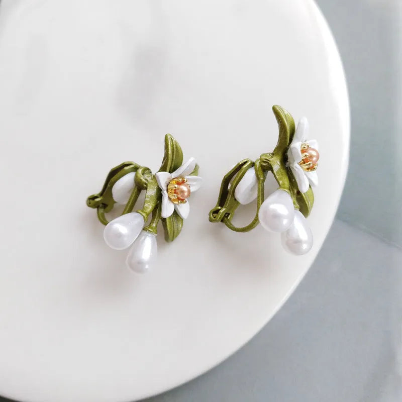Alloy camellia flower earrings with colour contrast design showing both ear stud and ear clip configurations