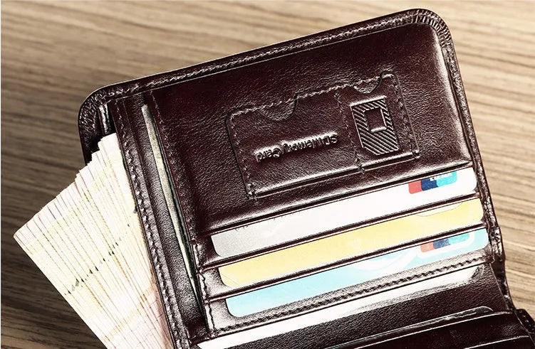 Men's leather wallet open to show internal card slots, cash section, coin pocket, and document holder.