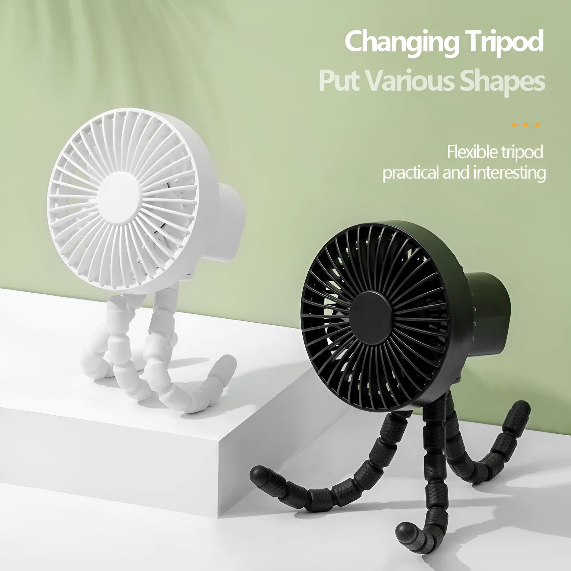 Compact USB desktop fan with flexible black tripod legs and a white fan head on a wooden desk.