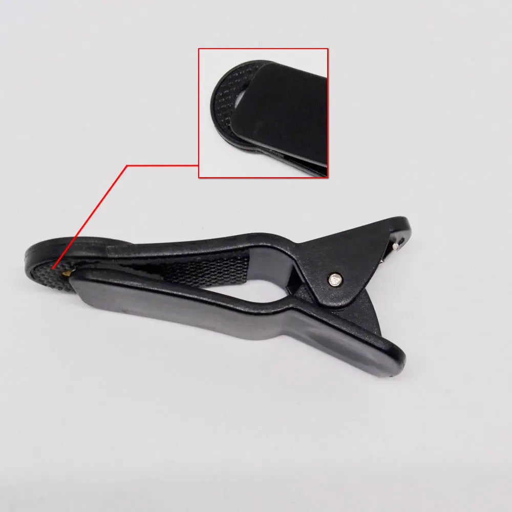 12x universal telescopic lens with collar clip attached to a mobile phone for zoom photography.
