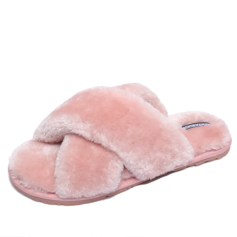 Women's black cross open-toe fur slippers on a non-slip patterned sole.