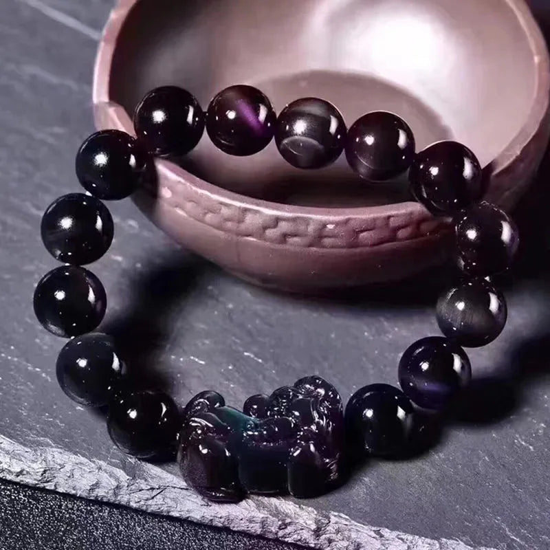 Natural ice colour eye obsidian crystal bracelet showing marbled patterning on beads