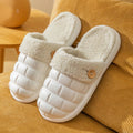 Plaid patterned detachable slippers with a warm plush lining and a textured EVA nonslip sole.