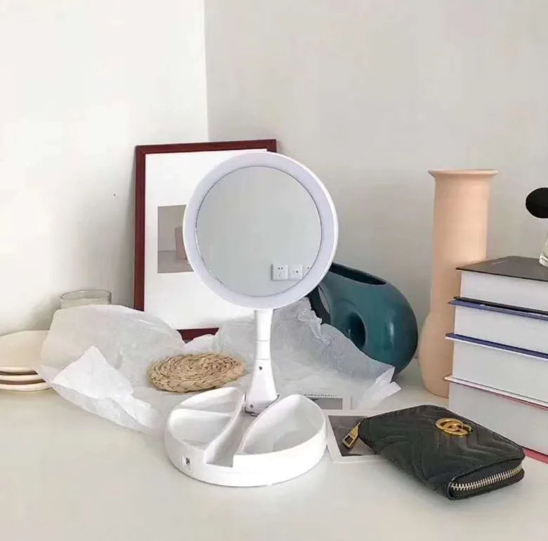 White foldable double-sided LED vanity mirror with USB charging port and storage compartments
