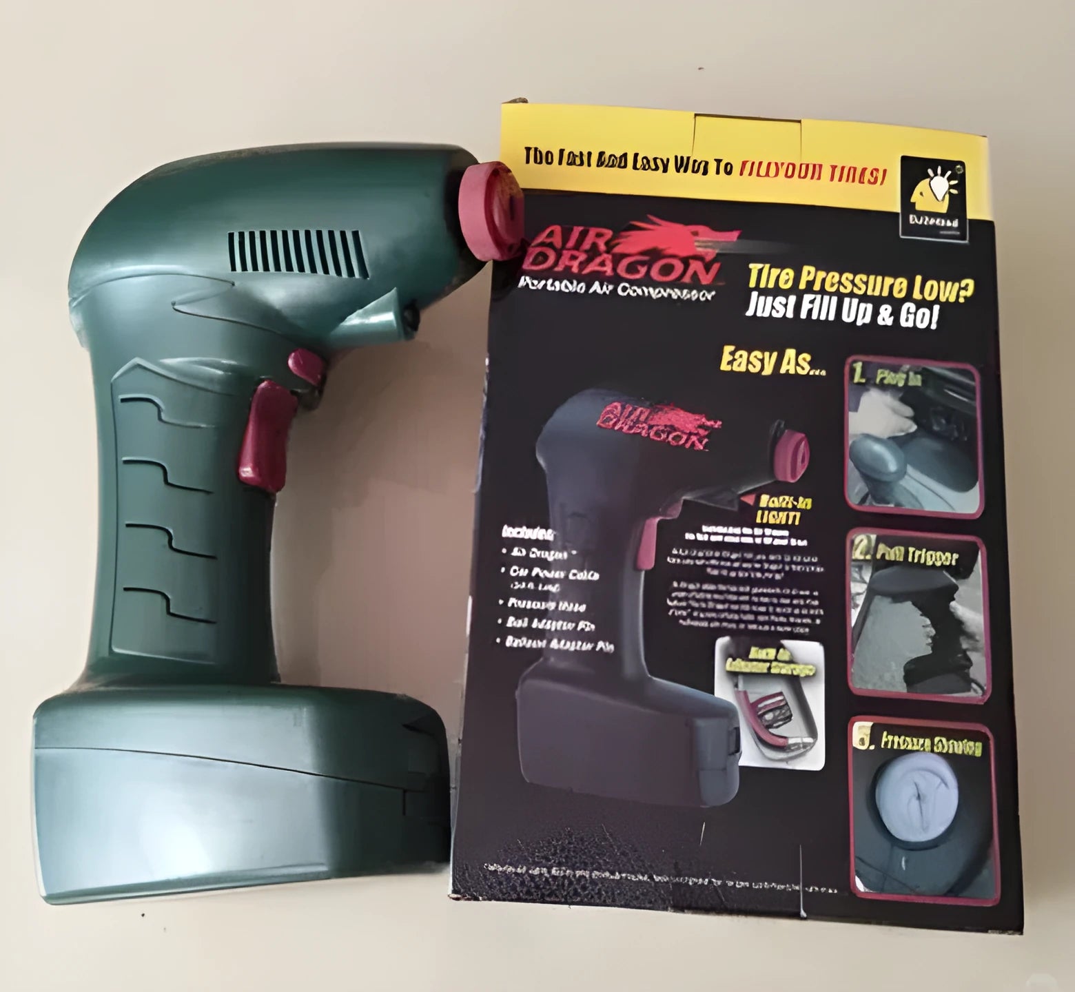 A portable 12V car electric tyre inflator pump unit with power cord and hose.