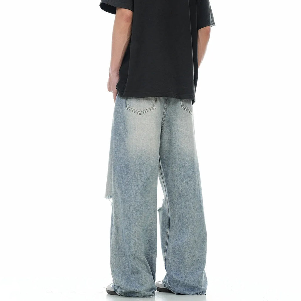 Blue straight-leg men's jeans with retro ripped detailing on cotton blend fabric