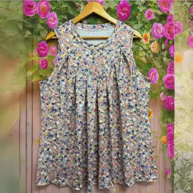 Plus size women's floral printed sleeveless vest in black colour showing loose fit design