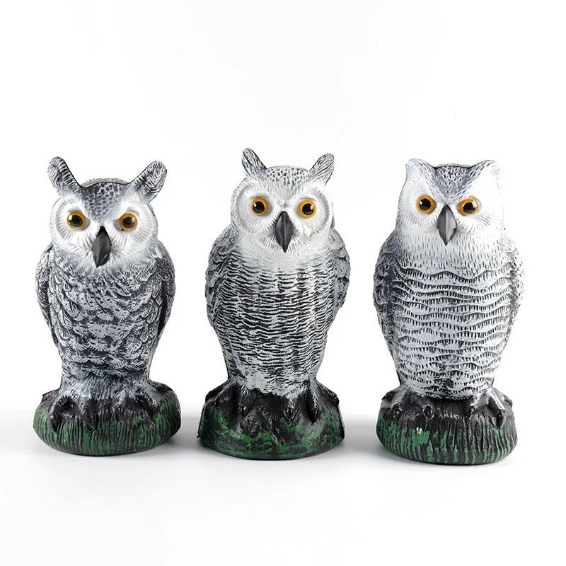 Three artificial plastic owls in red or white for garden pest control, each 20cm tall