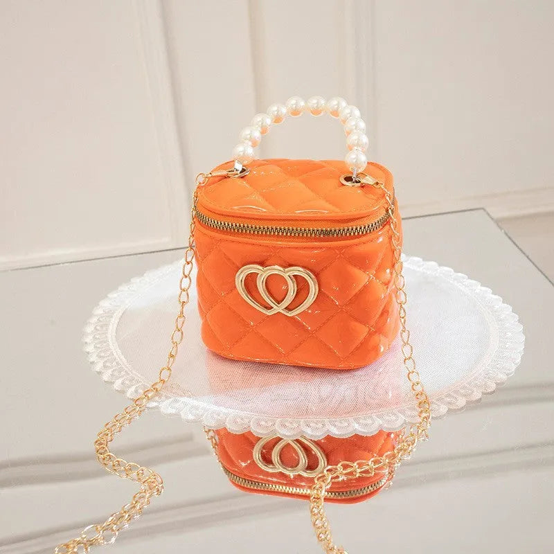 Women's PVC bucket shoulder bag with heart pattern in assorted colours