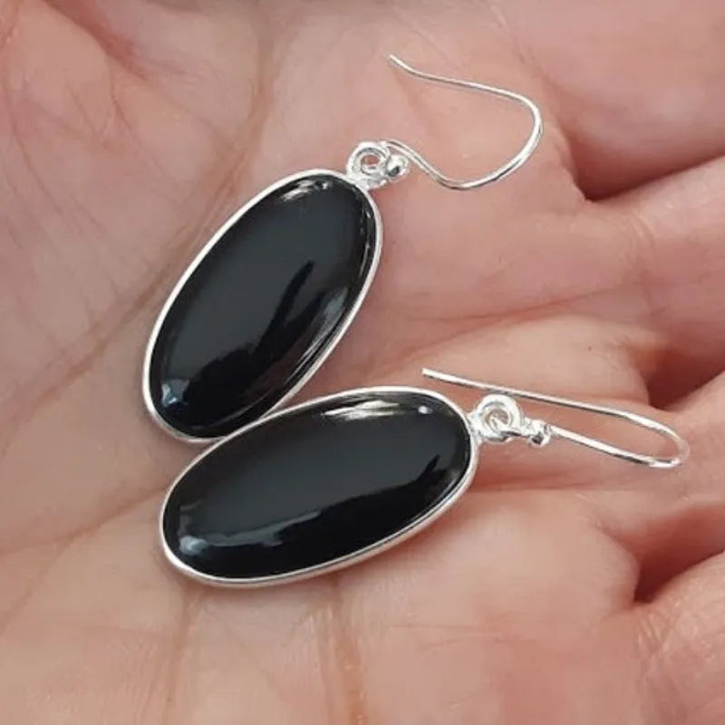 Black women's earrings with an oval black agate pendant on 925 silver, in a Chinese geometric style.