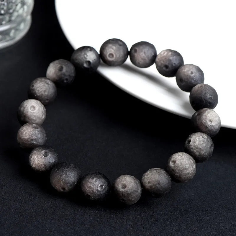Natural obsidian crater ball bracelet with grinding texture in silver or gold meteorite finish