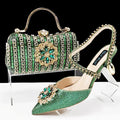 Women's black high heel ankle strap sandal with rhinestone flower and matching clutch bag.