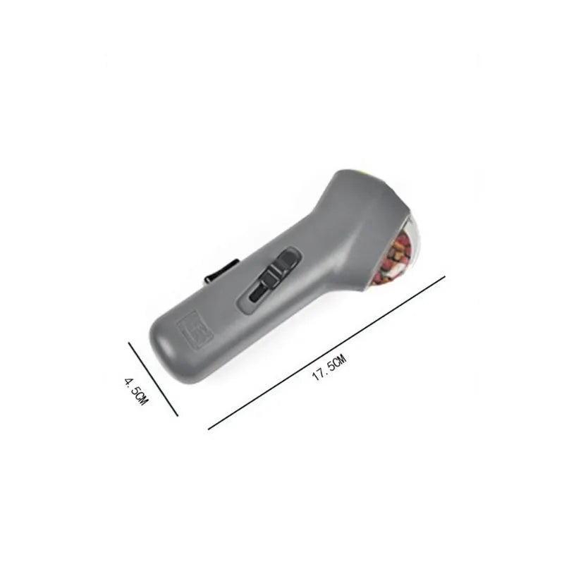 Grey plastic pet snack launcher toy measuring 18cm long for dog and cat treat dispensing.