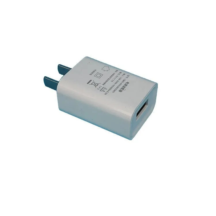 Slim white USB wall charger with 5V 1A output for mobile phones.
