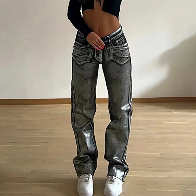 Blue high-waisted straight-leg jeans with washed denim finish on streetwear background
