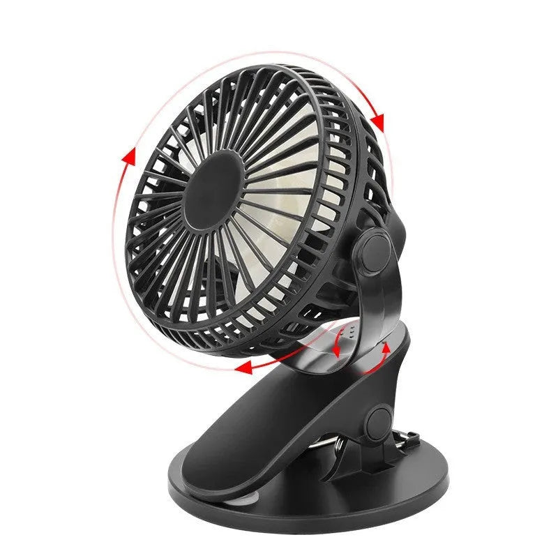 White USB rechargeable clip-on mini fan with plastic blades and a black clip, shown on a desk.