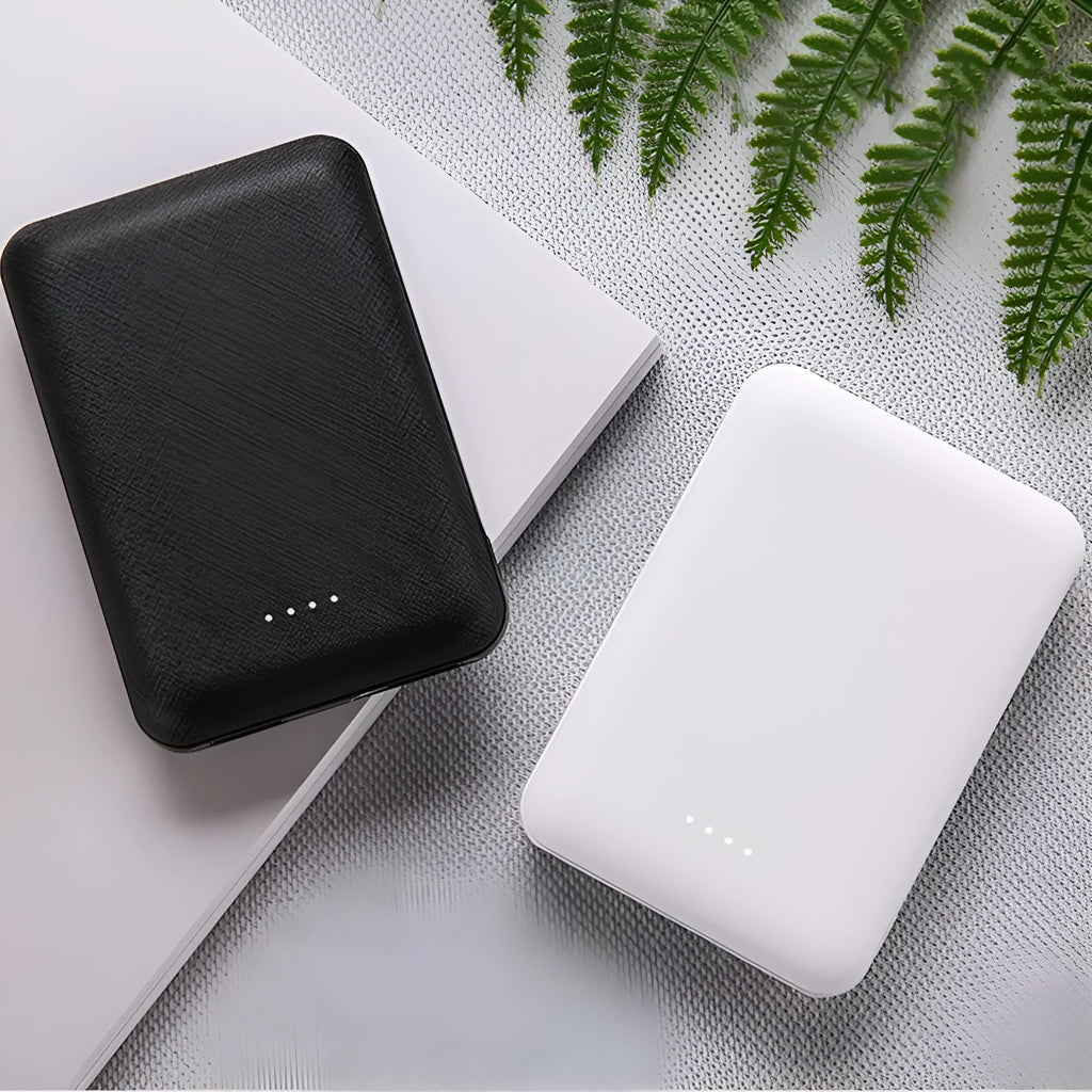 Ultra-thin black and white 10000mAh power bank showing multi USB ports and slim 22mm thickness