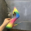 Rainbow glossy patent leather women's high heel shoes with pointed toe and thin high heel.