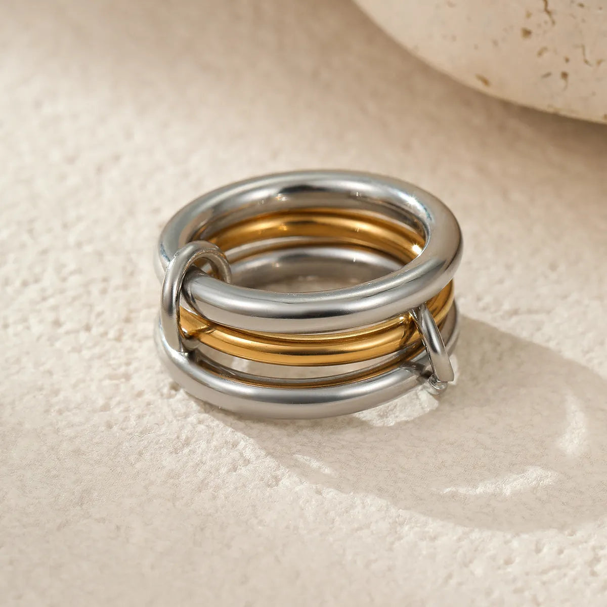 Stacked colour matching stainless steel ring with 18K gold plating and exaggerated design