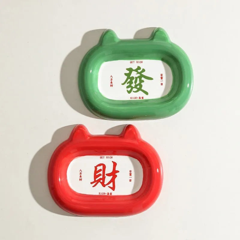 Ceramic pet feeding bowl with a choice of cat, frog, panda, or pig animal motif design.