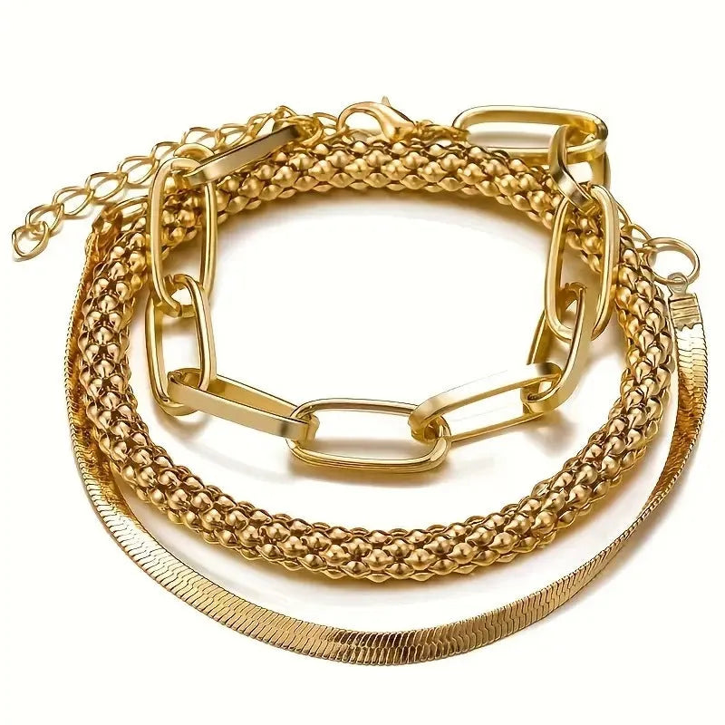 Set of three alloy snake bone chain bracelets in retro geometric design with electroplated gold finish