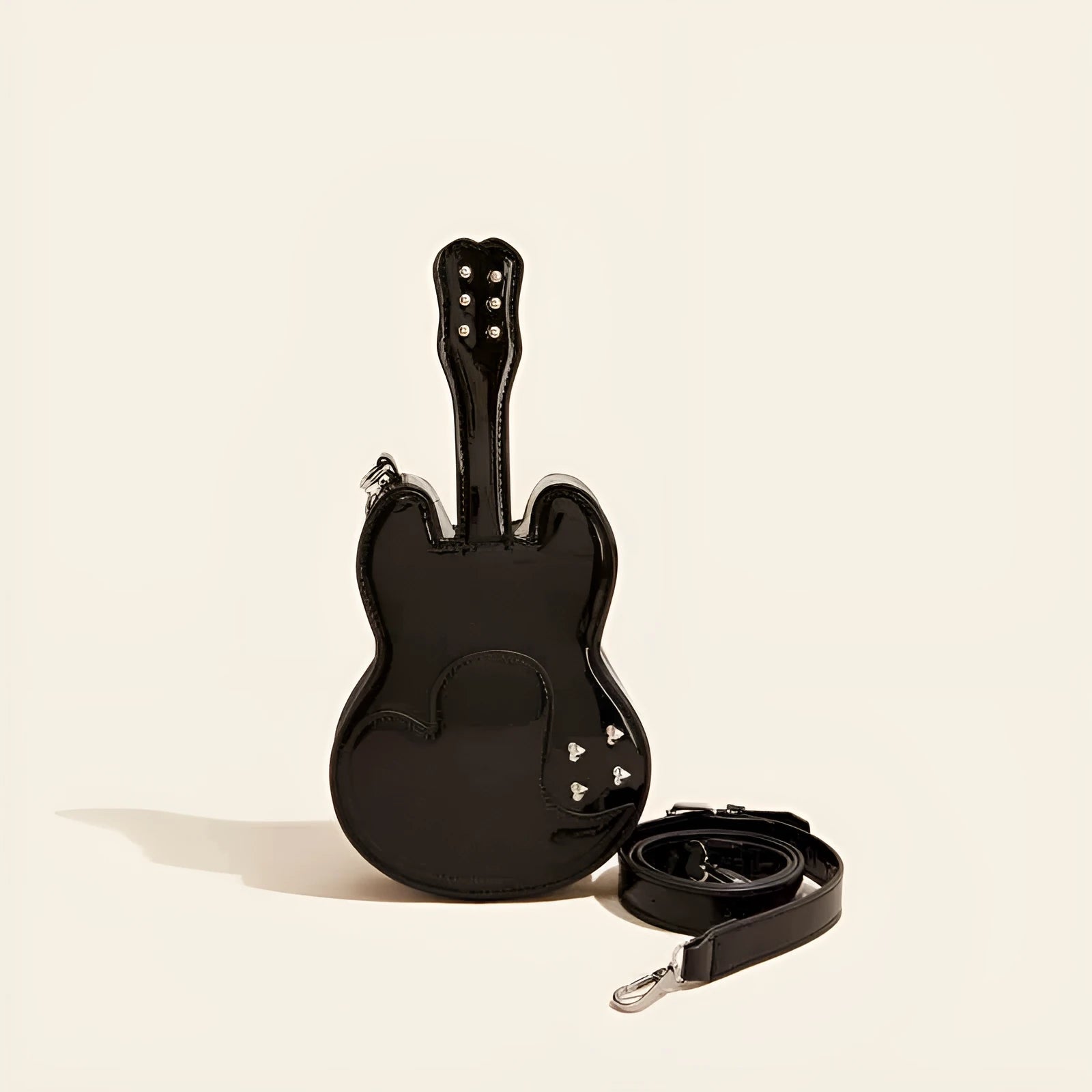 Silver guitar-shaped crossbody shoulder bag made from PU leather.