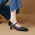 Women's black ankle-strap stiletto heels with a horse hair upper and square toe.