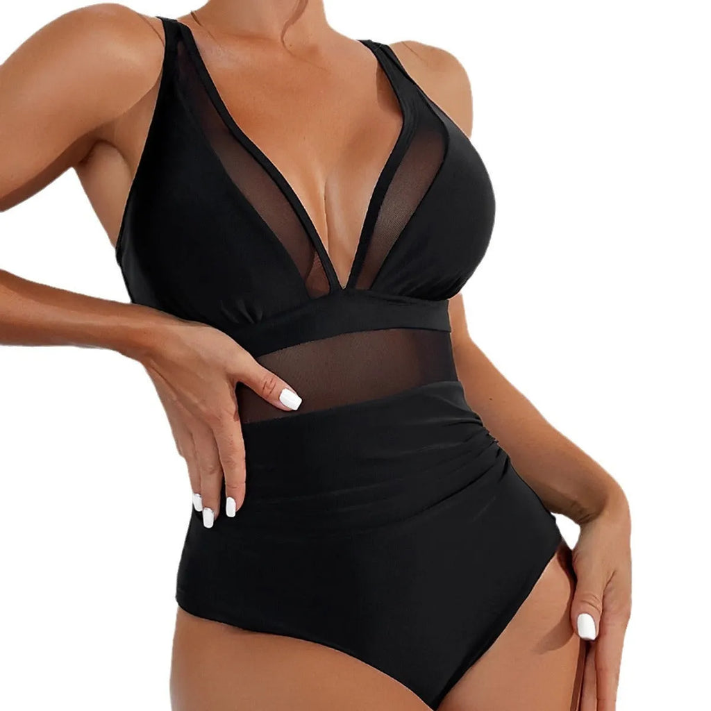Black mesh halter bikini one-piece swimsuit on model showing sleeveless design and briefs style