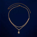 Women's gold rhinestone waist chain with water drop pendant and tassel details