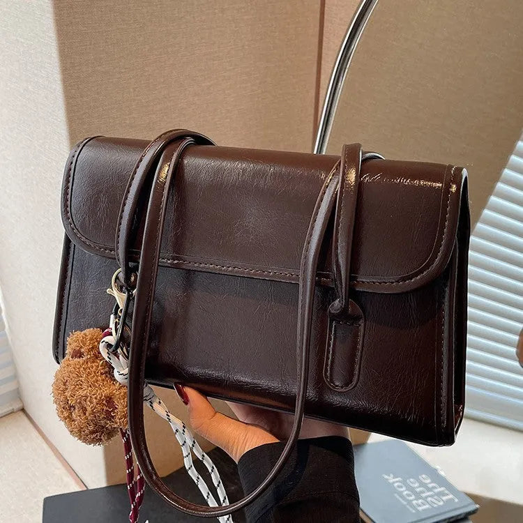Women's brown PU leather square shoulder bag with decorative pendant and double strap
